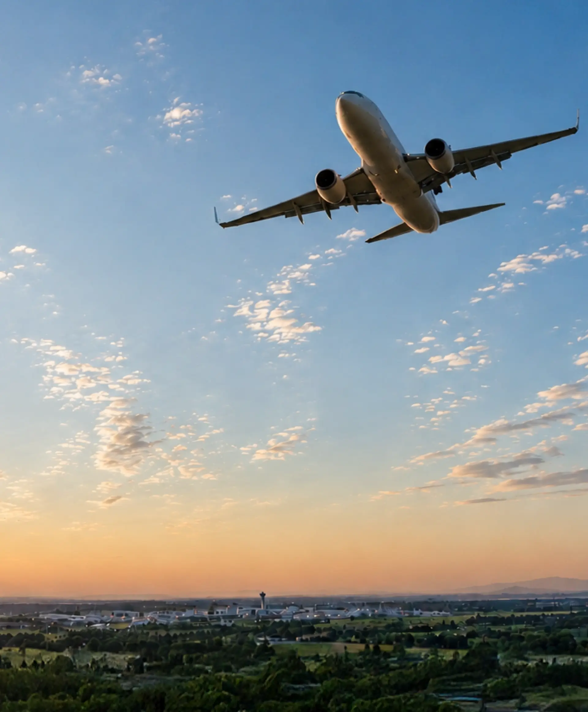 Airliner climbing through a bright sky